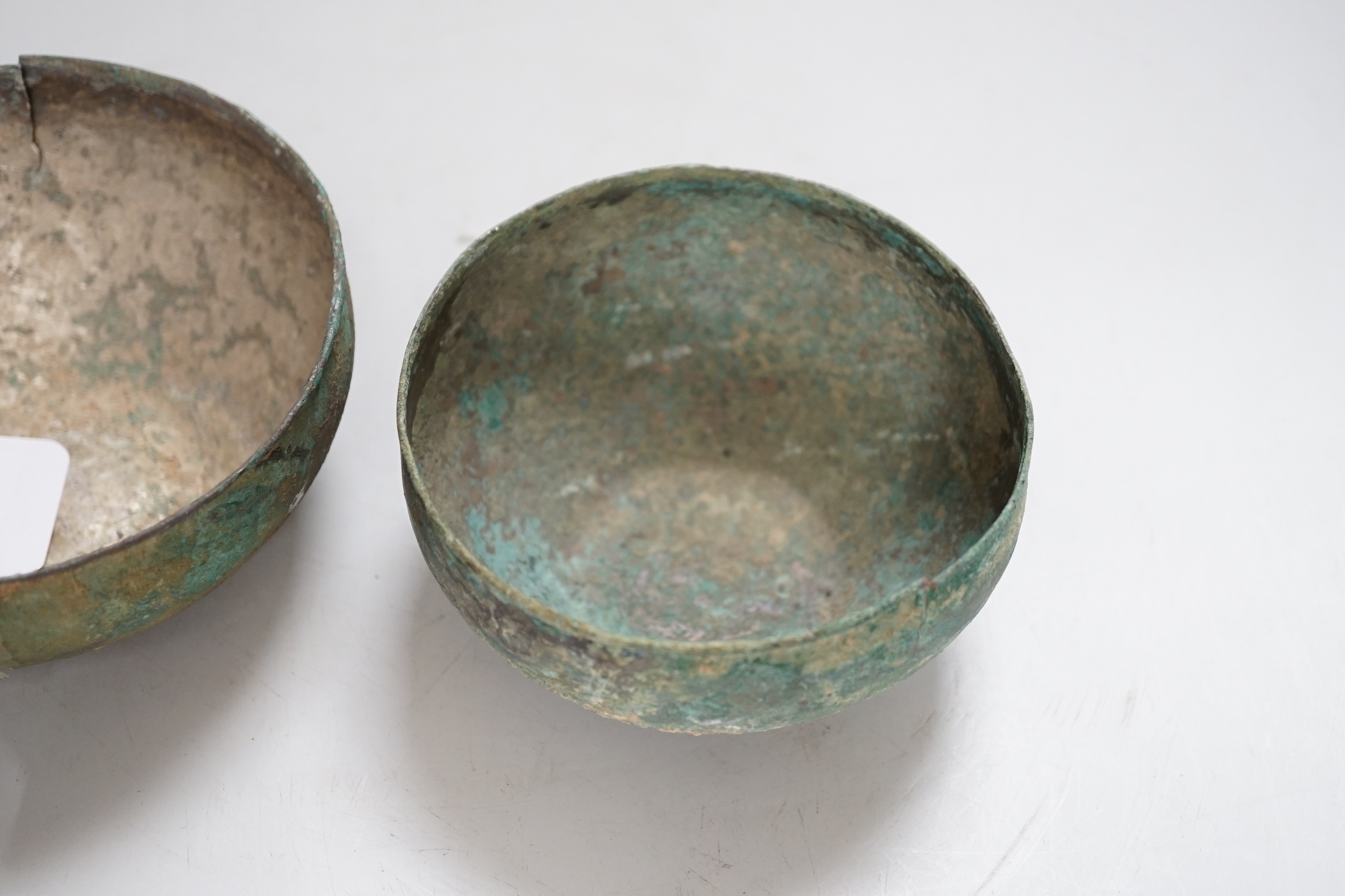 Two ancient South East Asian silver bowls, largest 14cm diameter